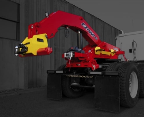 zacklift eztow unit installed on a 5th wheel truck, the lift is bring red and the truck is grayed out for contrast