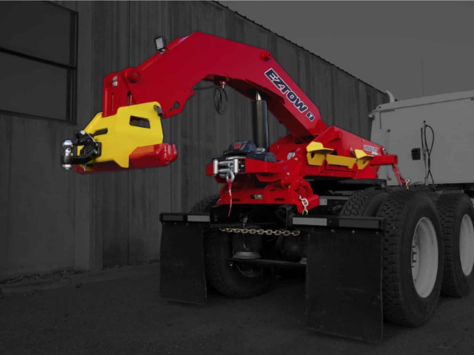 zacklift eztow unit installed on a 5th wheel truck, the lift is bring red and the truck is grayed out for contrast